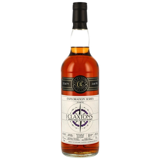 Schwarzbach Spirits Auchroisk 11 Year Old single malt Scotch whisky in a clear glass bottle with a black cap. Amber liquid, exploration series label with compass design.