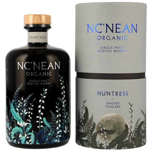 Schwarzbach Spirits NC'NEAN Huntress Malted Teacake Single Malt Scotch Whisky in black bottle with botanical design and grey tube packaging.